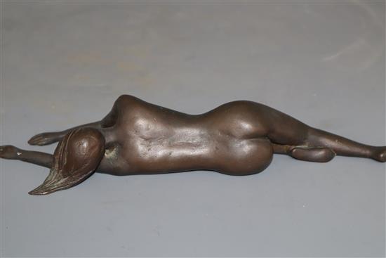 A bronze of a sleeping recumbent nude lady, length 28cm